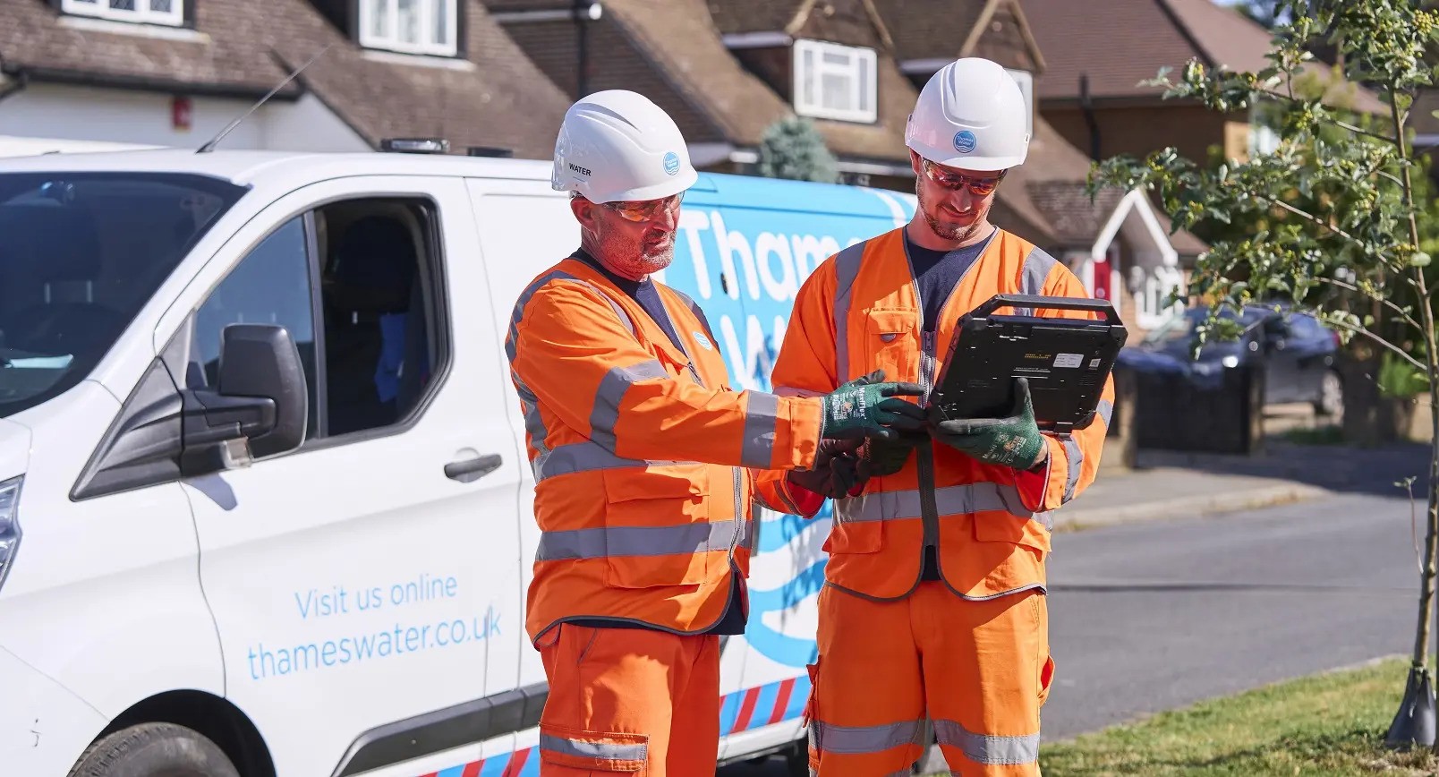Two engineers assessing a leak