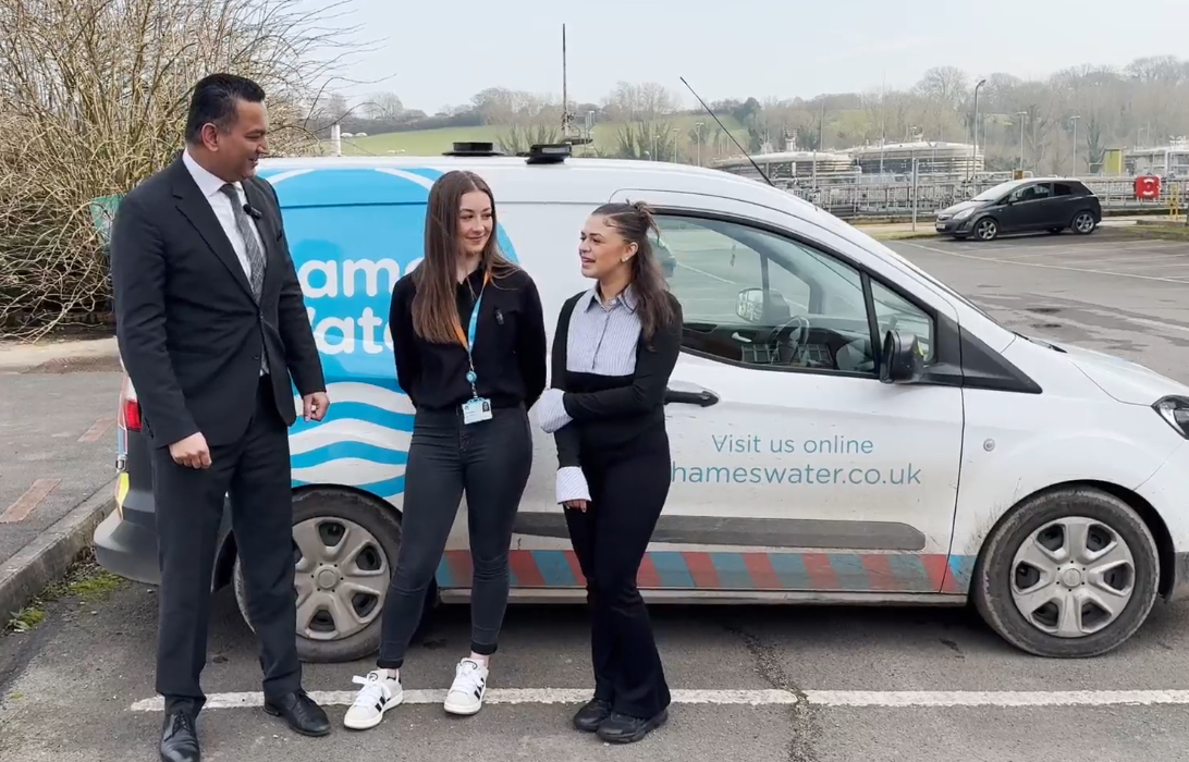 Gagan Mohindra and two apprentices stand in front of a thames water van