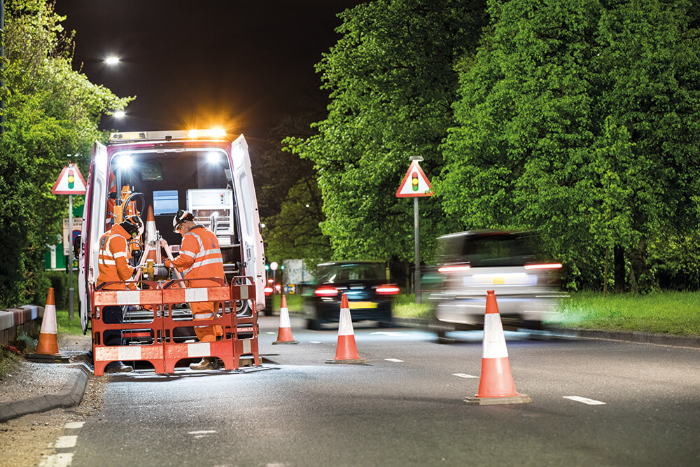 Thames Water van with cones and traffic management barriers