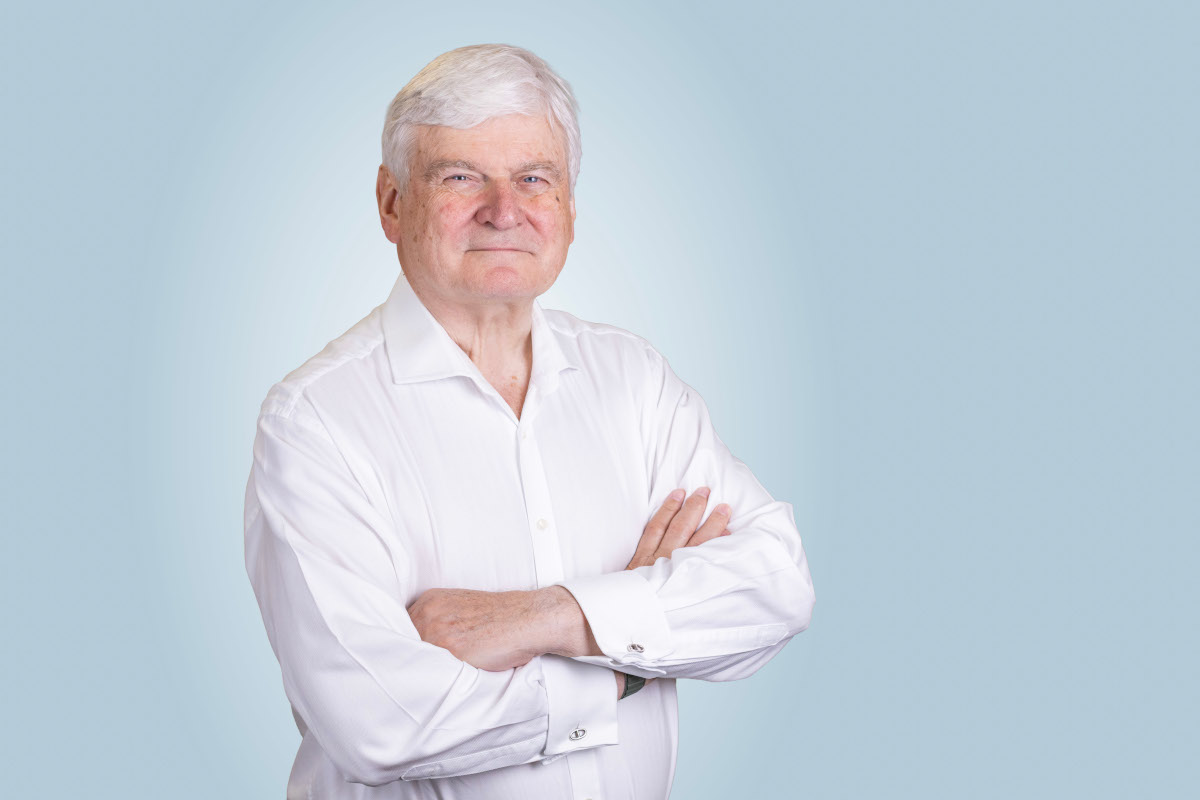 A headshot photo of Sir Adrian Montague