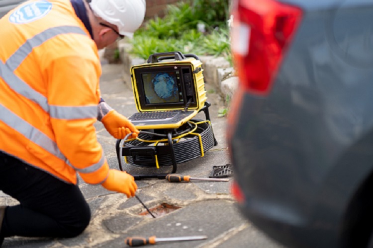 Engineers using a camera to check the sewers