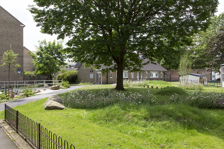 A building surrounded by greenery 