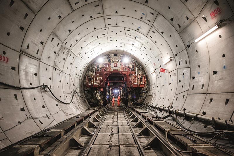Photograph of workers in a tunnel