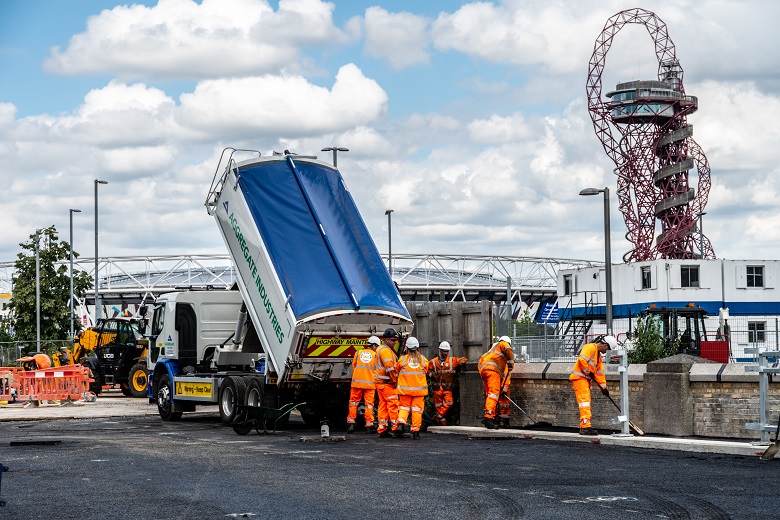 Workers resurfacing the cycle lane