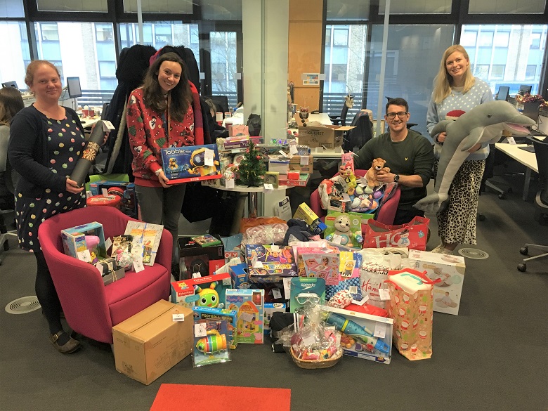 Thames Water staff with the pile of toys for donation