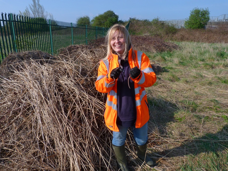 Karen Sutton holding two slow worms at Crossness Nature Reserve