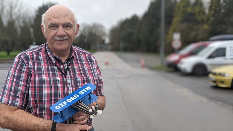 Bob Steptoe retires from Oxford sewage works with a model plane made for him by colleague