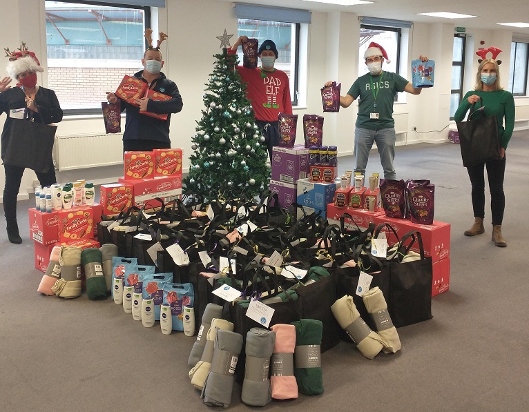 Thames Water volunteers with winter care packages for the elderly in London