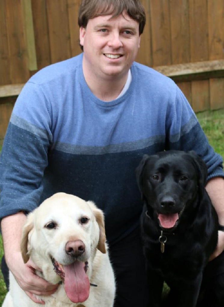 Frankie Tipton with Victoria and previous guide dog Bentley in 2018