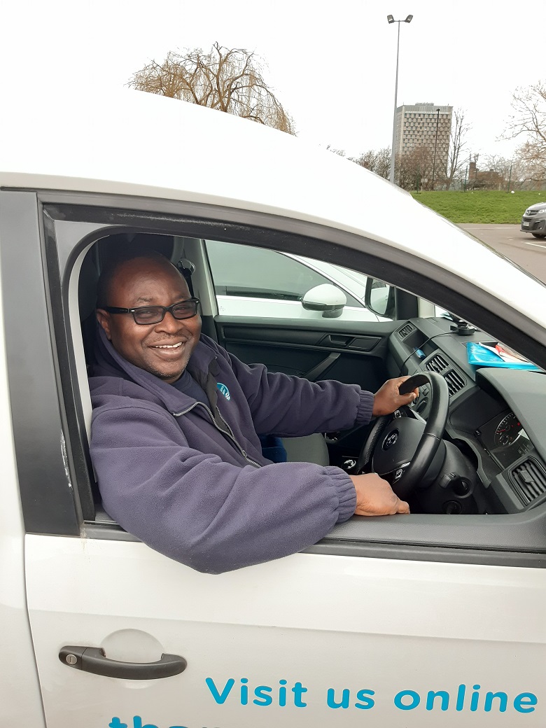 Akeem sitting in his van