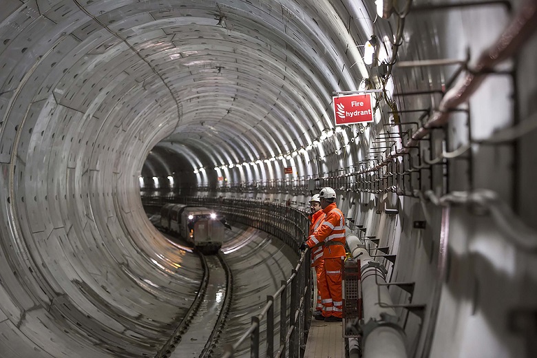 Two Thames Water engineers inside a tunnel