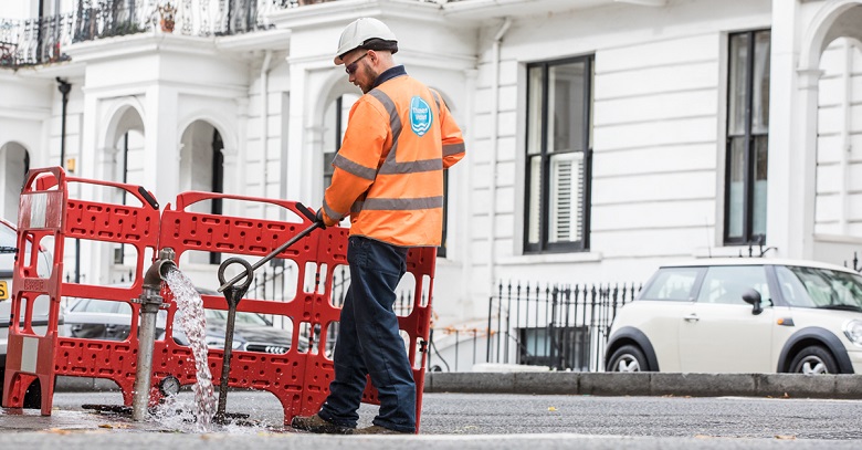 A Thames Water engineer carrying out work on a London street