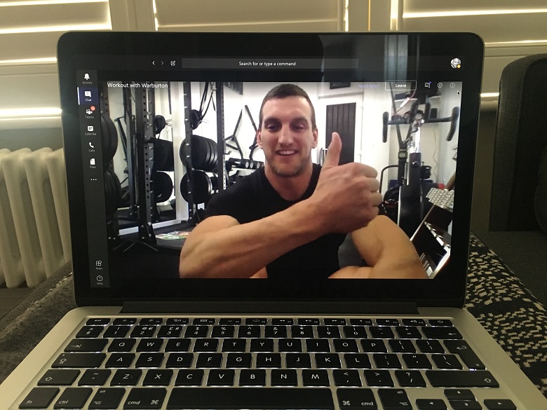 Sam Warburton hosting a remote workout session on a laptop screen. 