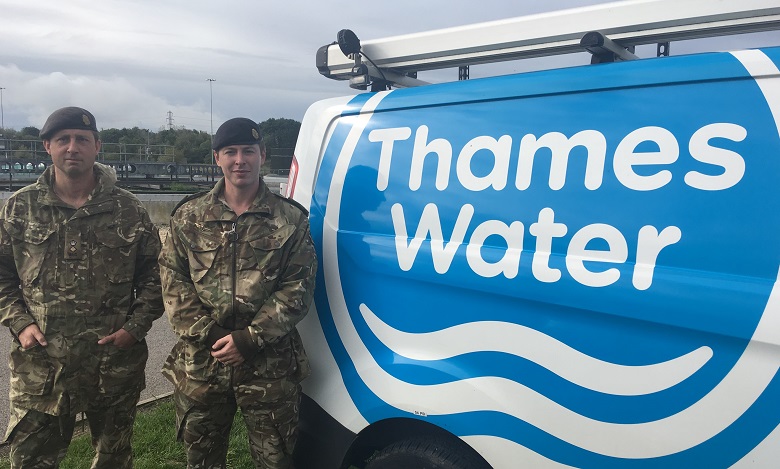 Two soldiers next to a Thames Water van