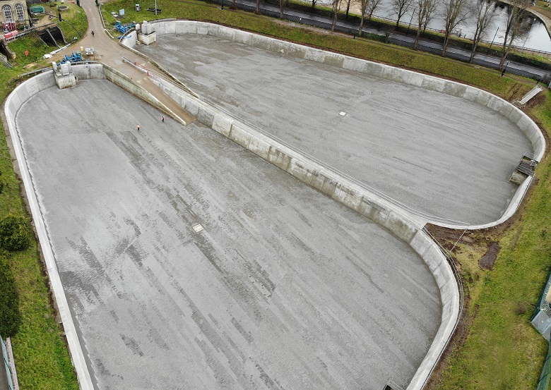 Two grey and empty filter beds.
