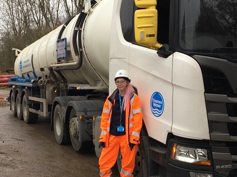 Lucianna standing infront of a Thames Water tanker lorry