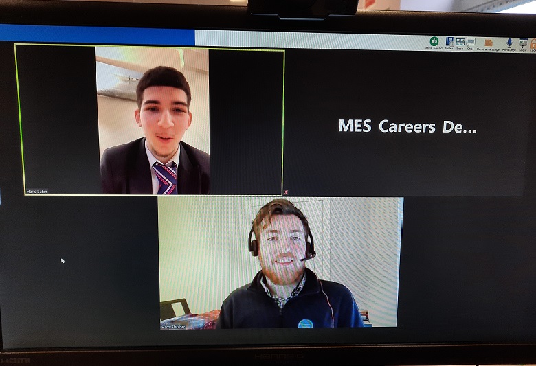 Two people speaking on a computer screen