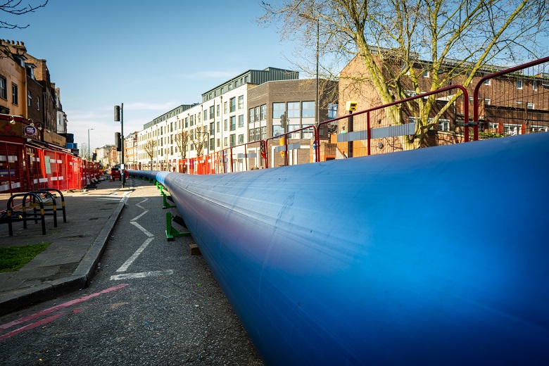 large blue water pipe ready for installation on London street