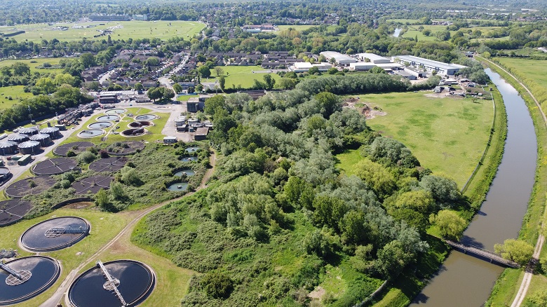 Aerial photo of esher sewage treatment works, green trees and the River Mole