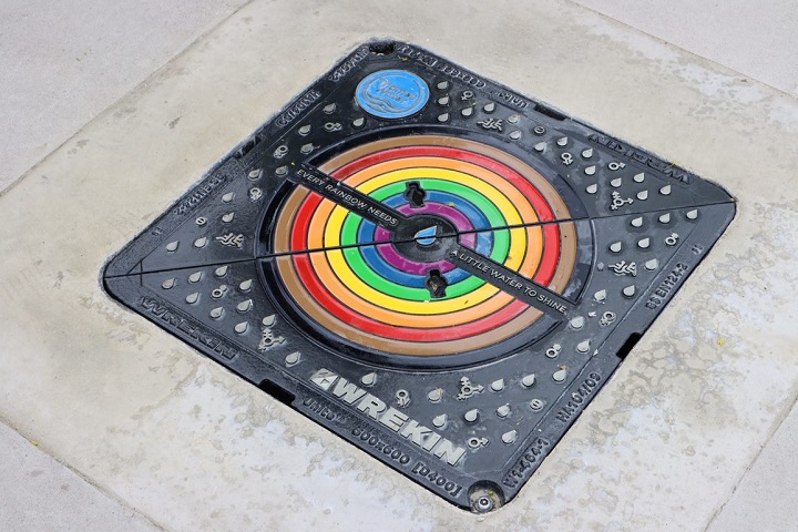 A rainbow drain cover.