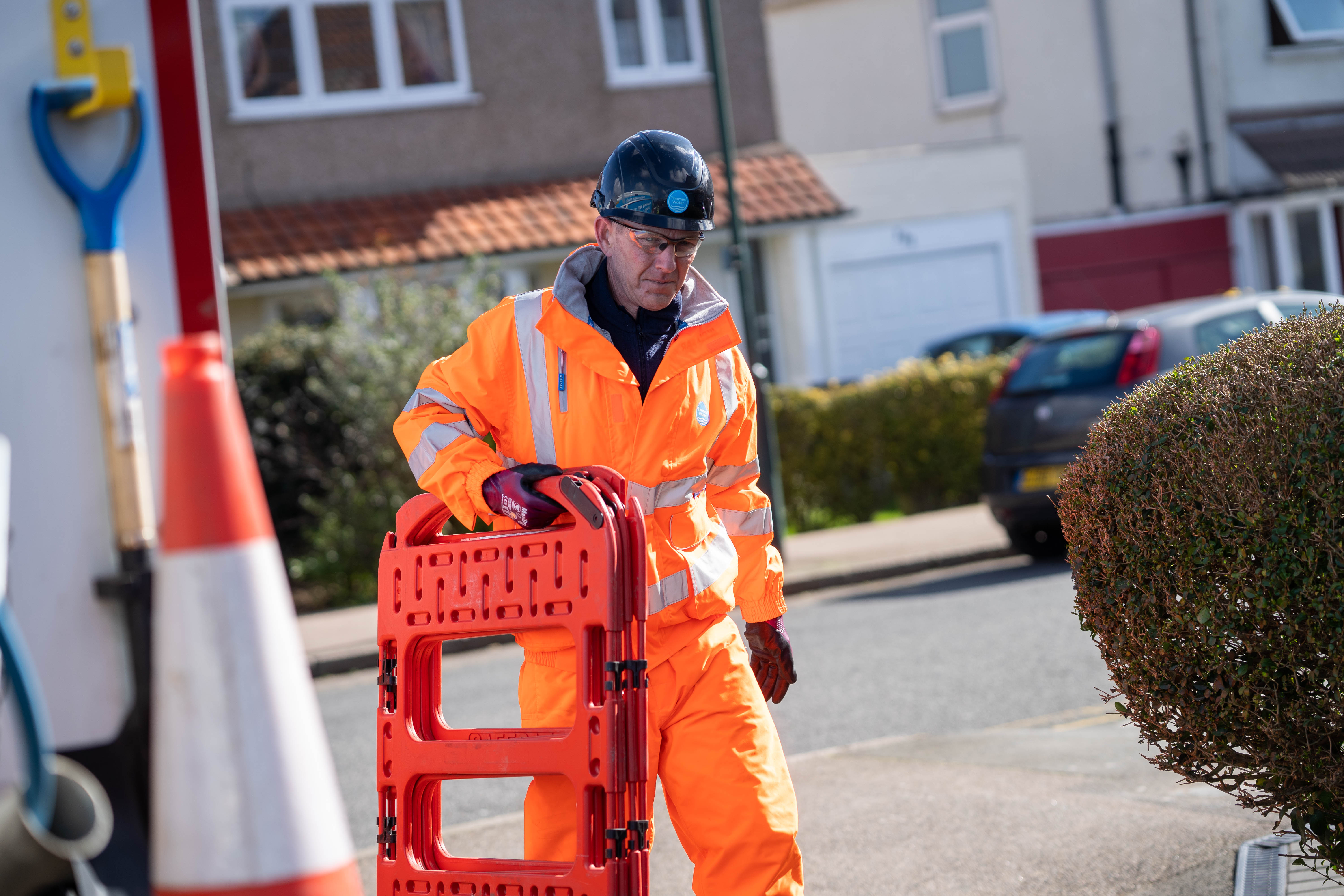worker putting a barrier up