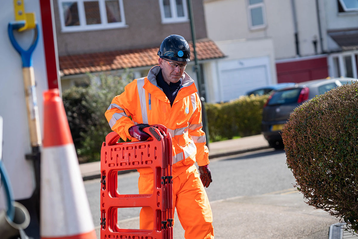 worker putting barriers up