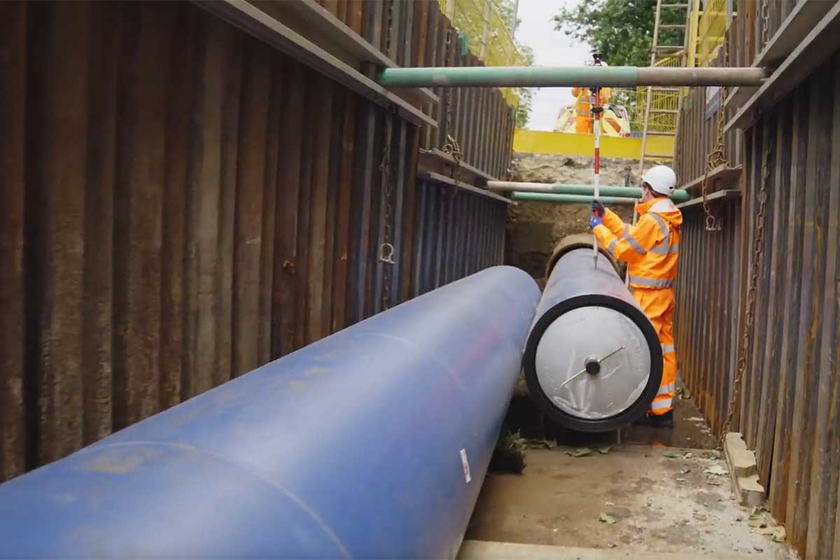An engineer works to upgrade the mains water pipe