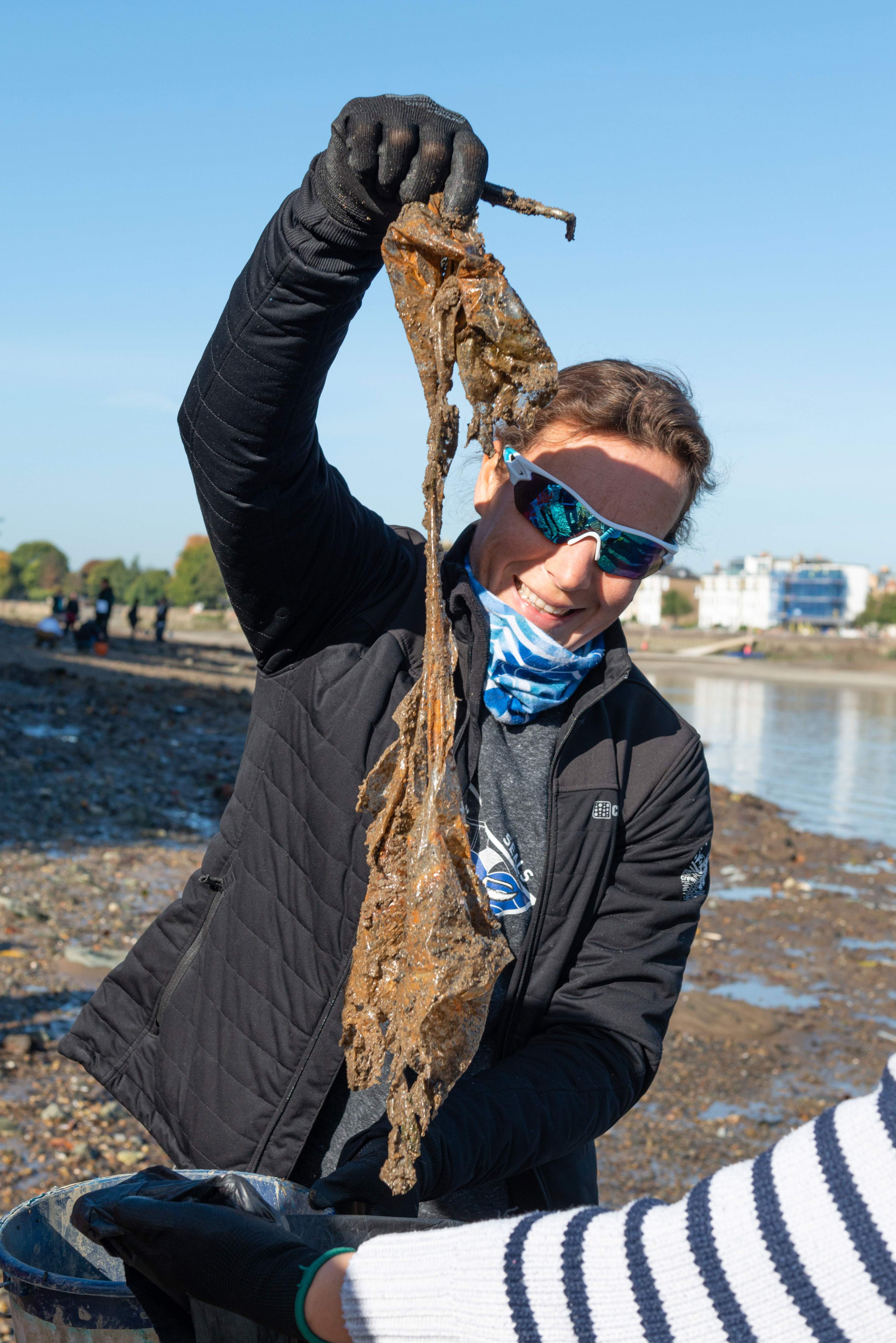 A volunteer during a clean up at Wet Wipe Island near Hammersmith Bridge