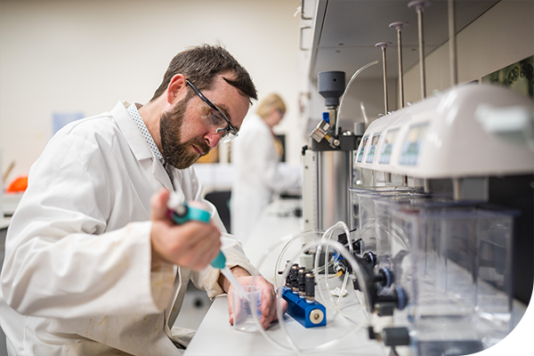 A Thames worker tests water quality in a lab