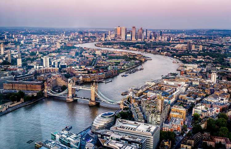A view over London with the River Thames and Tower Bridge in the foreground.