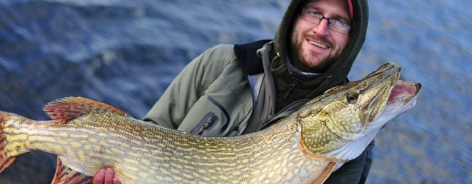 Fisherman with large pike