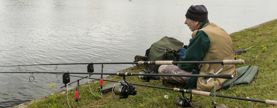 Person fishing from the bank at Walthamstow Wetlands