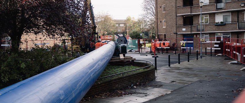 A large pipe running across a street