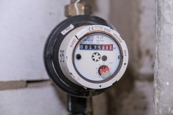 Mechanical water meter in cupboard