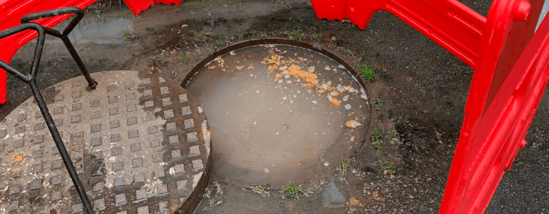 Flooded manhole from sewer flooding