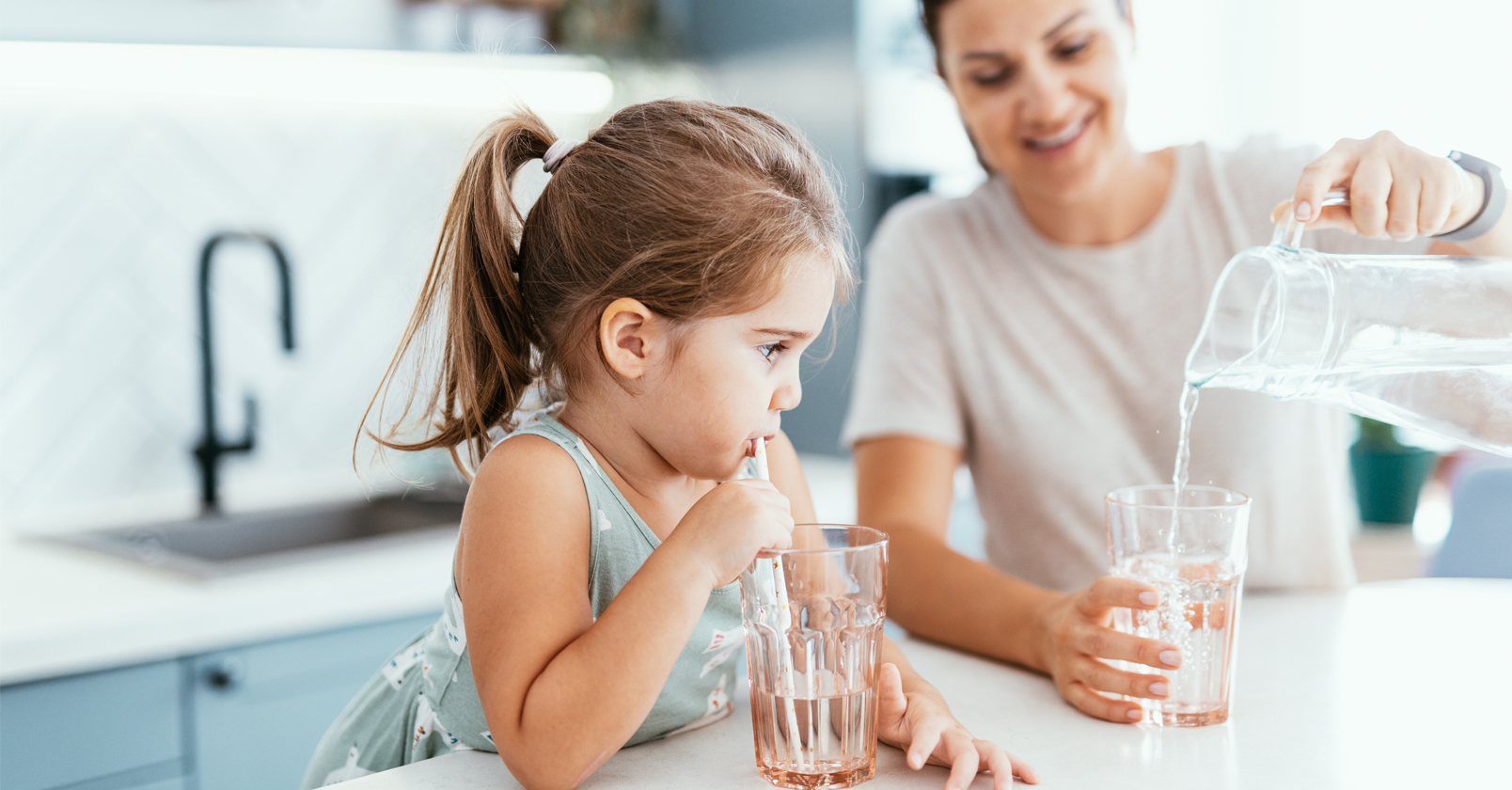 family pouring and drinking water