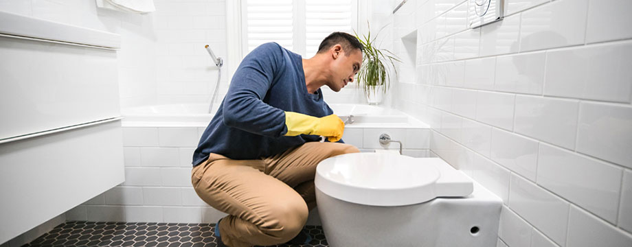 A customer fixes a leak loo