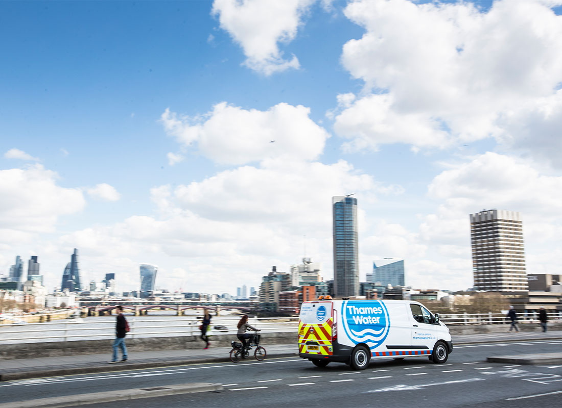 Thames water van drives over a bridge in central London