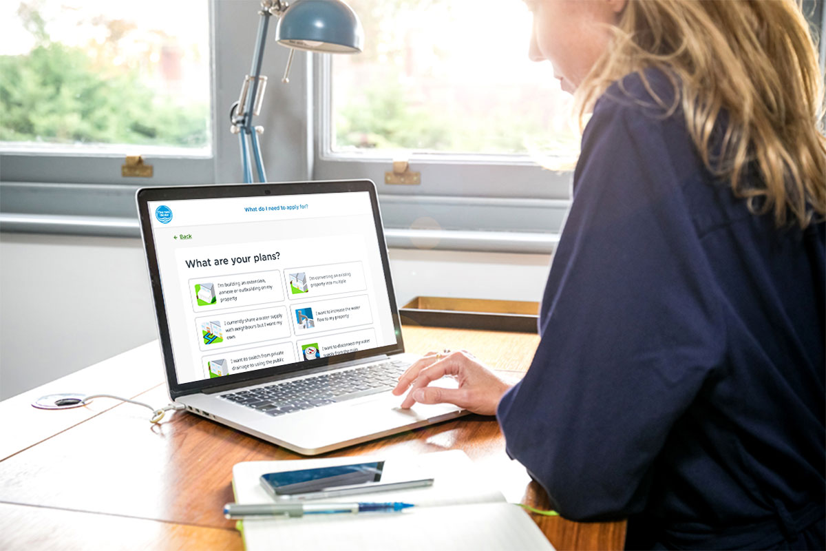 woman on computer completing developer services triage process