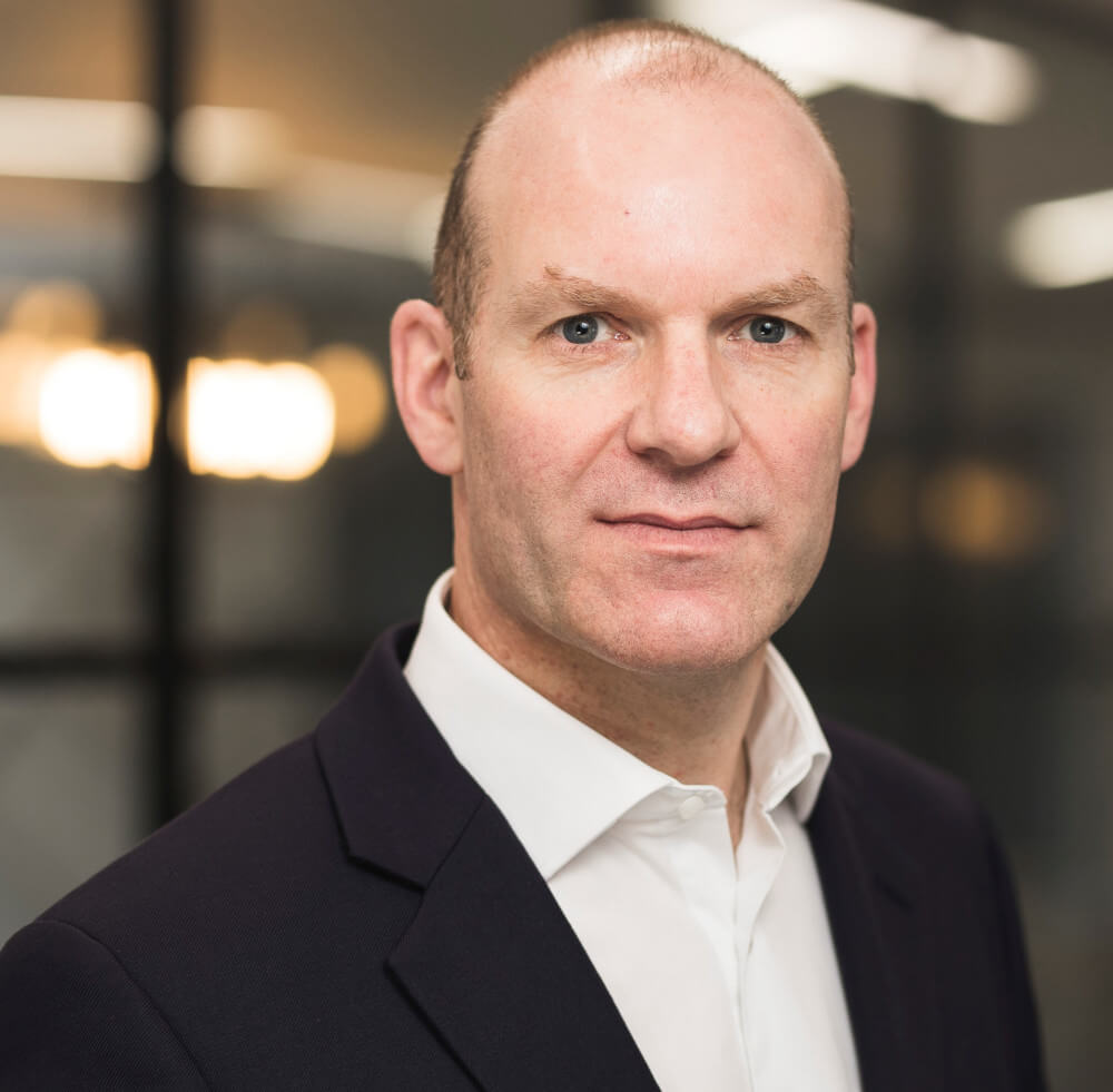 A headshot photo of Neil Robson