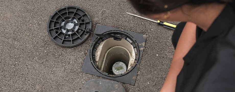 A customer reads digital water meter