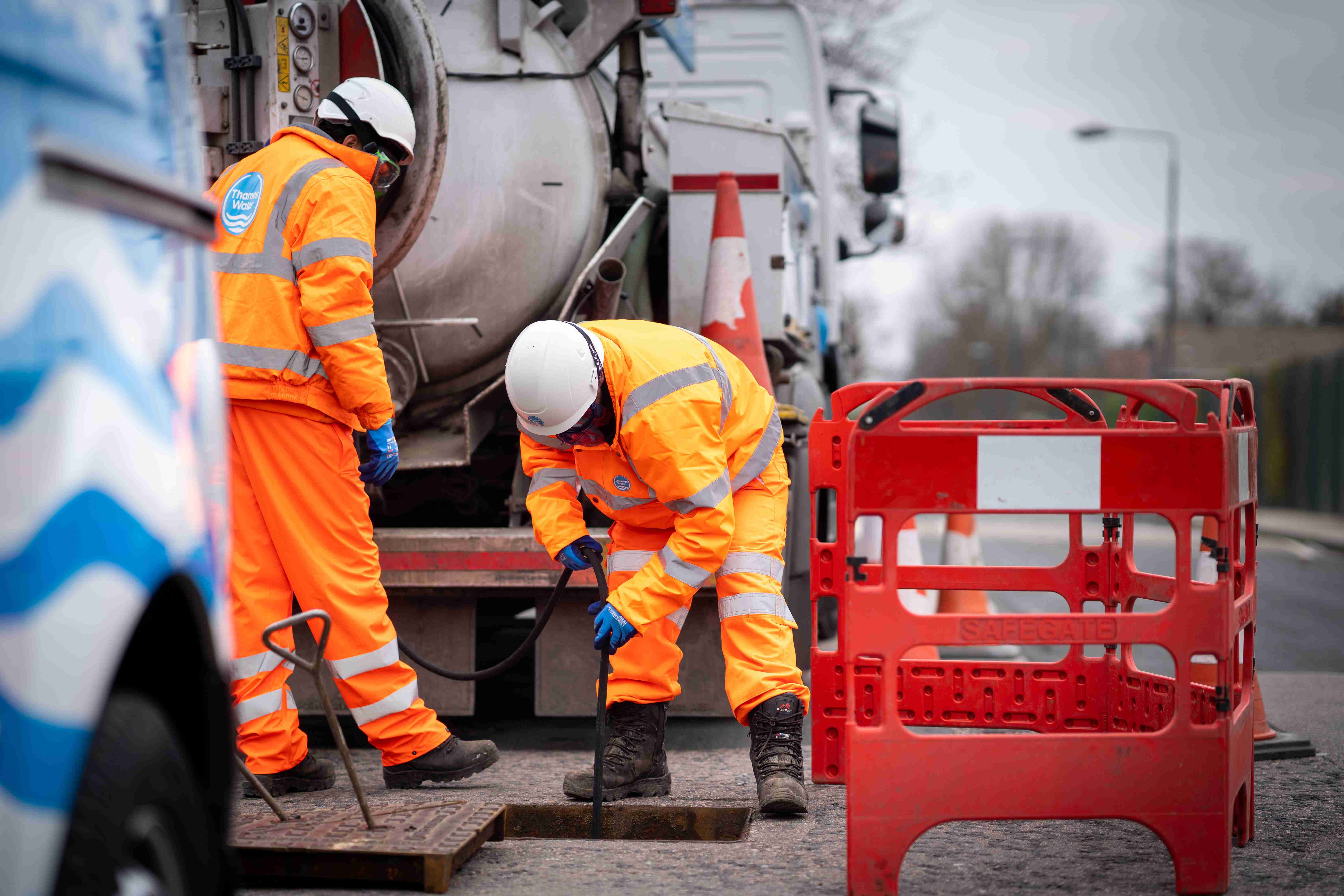 Thames water engineers working on the street