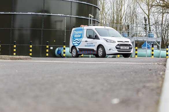 A thames water van parked outside a building
