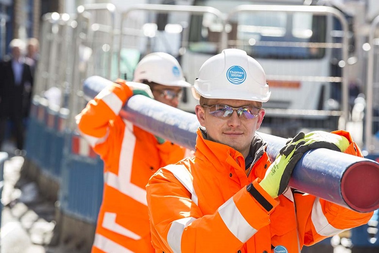Engineers fixing a pipe