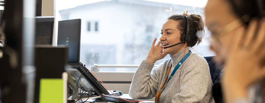 Lady taking a call at a call centre