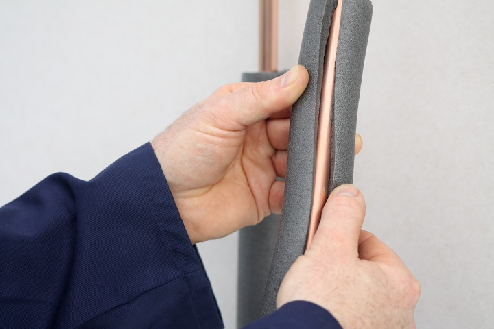 Customer insulating a copper pipe