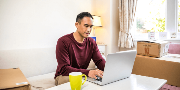 person using laptop before moving