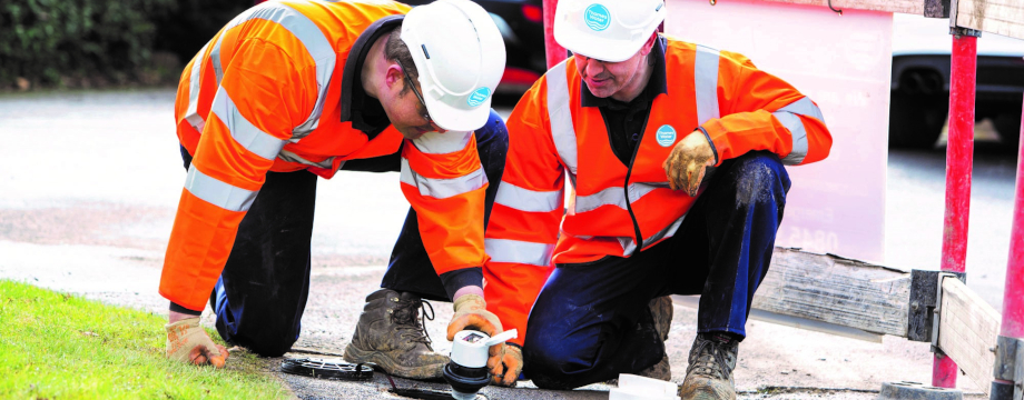 Thames Water engineers installing water meter