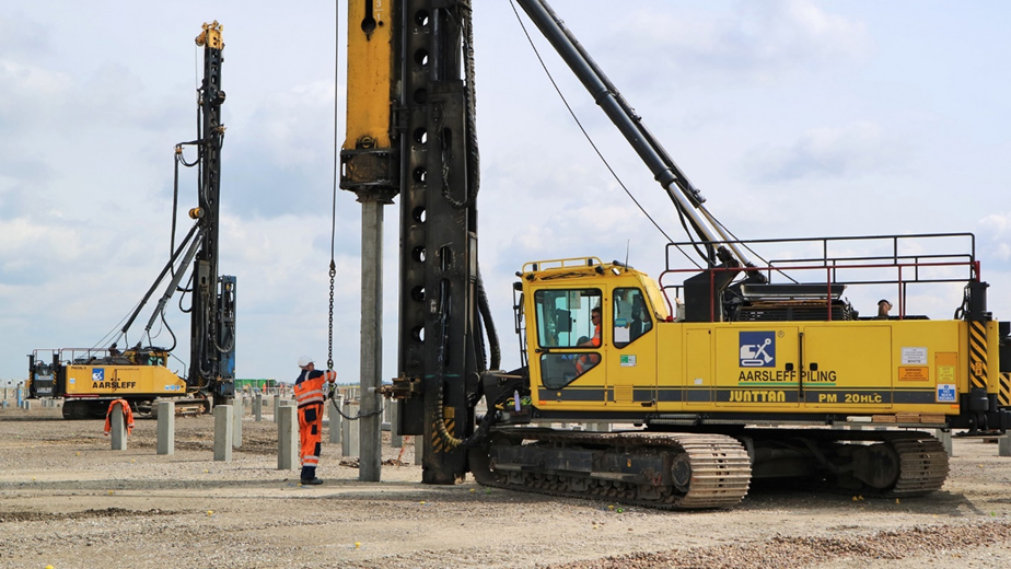 Piling rigs driving piles into the ground