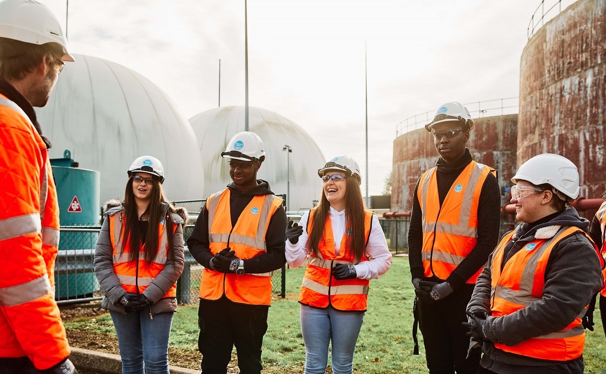 Group of students interacting with Thames Water engineer